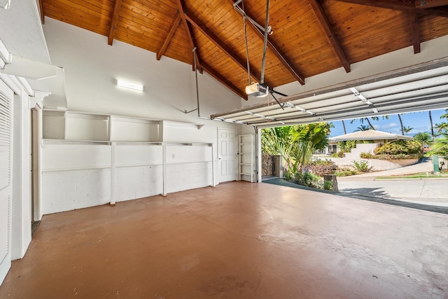 garage with a garage door opener and wooden ceiling