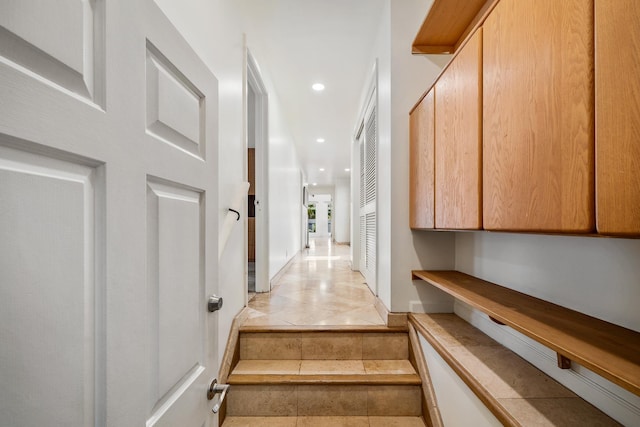 stairs featuring tile patterned flooring