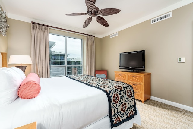 bedroom featuring ceiling fan and crown molding