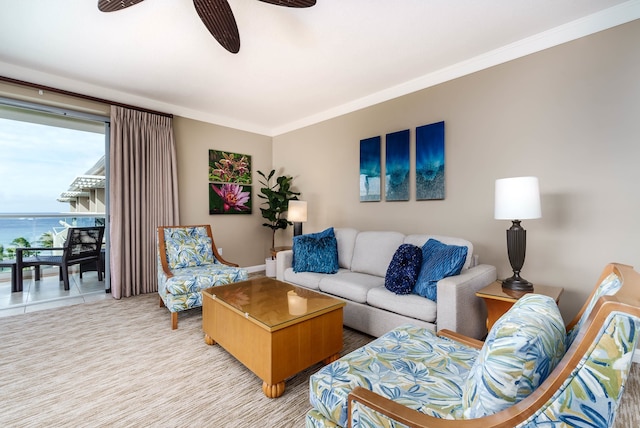 living room featuring ceiling fan and ornamental molding