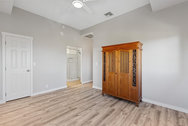 unfurnished bedroom with ceiling fan and light hardwood / wood-style flooring