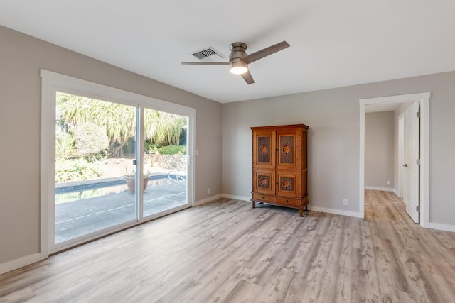 unfurnished room featuring light hardwood / wood-style flooring and ceiling fan