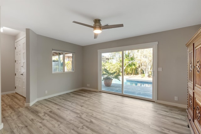 spare room with ceiling fan and light hardwood / wood-style flooring