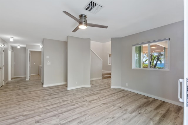 unfurnished living room with ceiling fan and light hardwood / wood-style floors