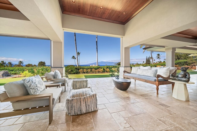 view of patio / terrace with a mountain view and an outdoor living space