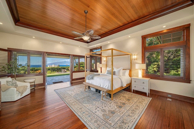 bedroom featuring dark hardwood / wood-style flooring, multiple windows, wooden ceiling, and ceiling fan