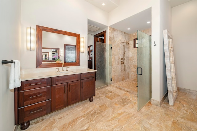 bathroom featuring vanity and a shower with door