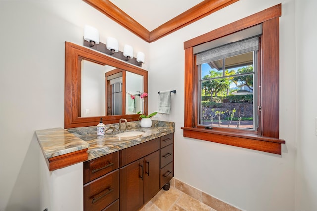 bathroom featuring vanity and ornamental molding