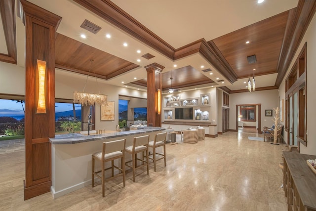 bar with a chandelier, decorative light fixtures, crown molding, and wood ceiling