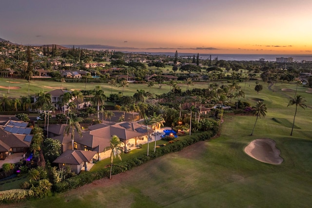 aerial view at dusk with a water view