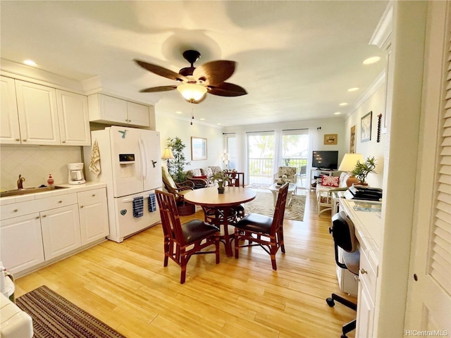 7146 Kamehameha V Hwy Unit 207C, Kaunakakai, HI 96748 - dining space featuring a ceiling fan, ornamental molding, recessed lighting, and light wood-type flooring