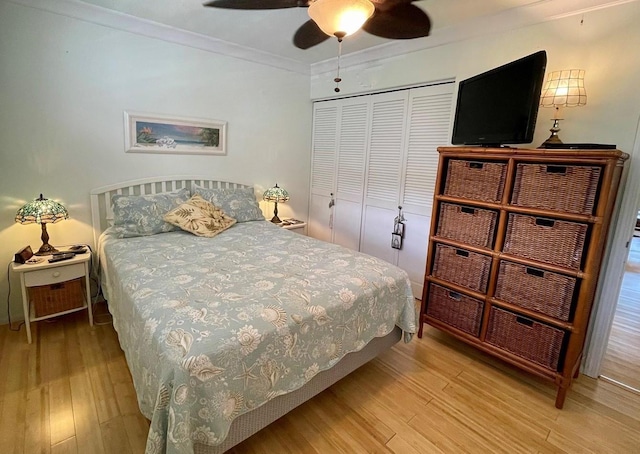 7146 Kamehameha V Hwy Unit 207C, Kaunakakai, HI 96748 - bedroom with wood finished floors, crown molding, a closet, and a ceiling fan