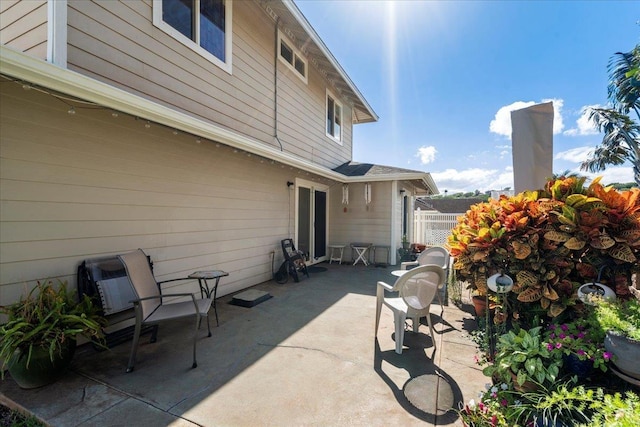 view of patio / terrace featuring fence