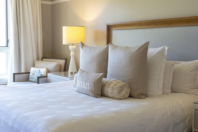 bedroom with ornamental molding