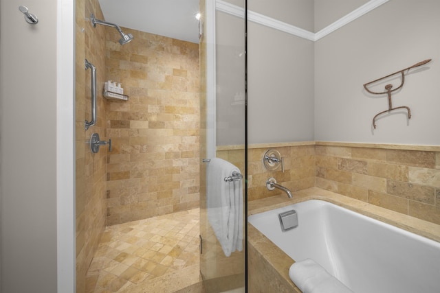 bathroom featuring crown molding and shower with separate bathtub