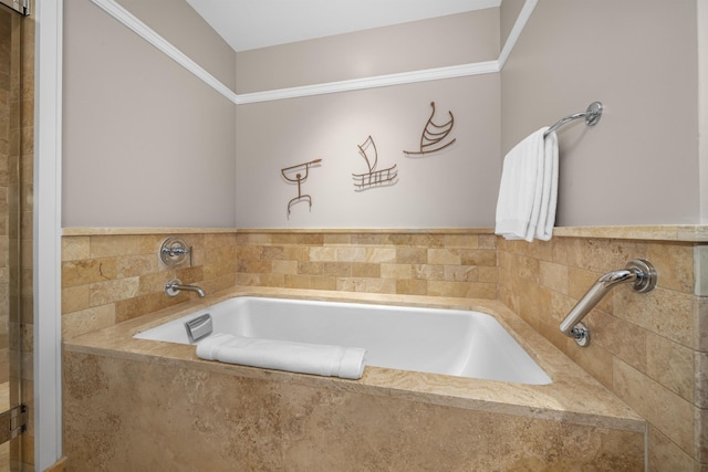 bathroom featuring tiled bath