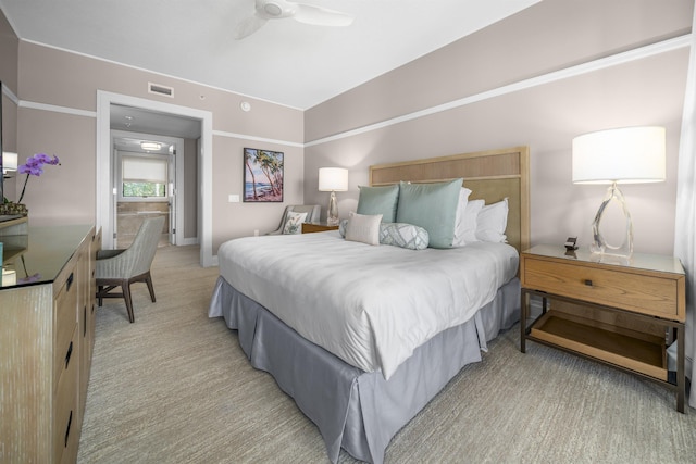 bedroom featuring ceiling fan and light colored carpet