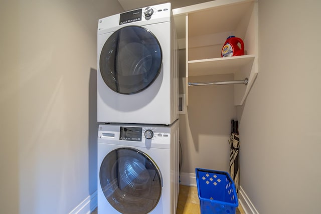 laundry area with stacked washer / dryer