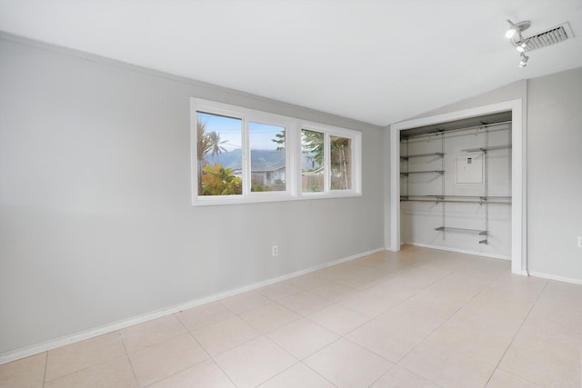 unfurnished bedroom featuring light tile patterned floors and a closet