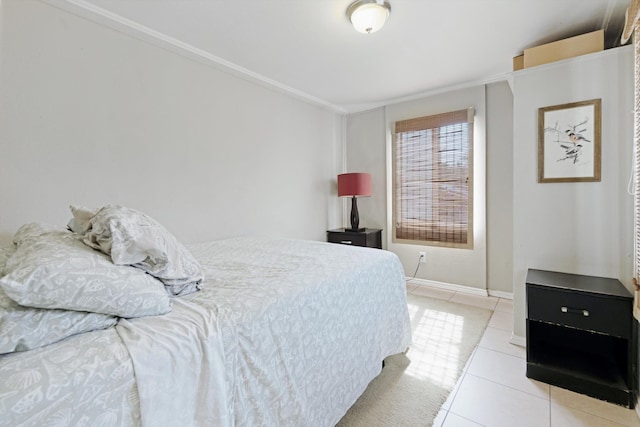 bedroom with light tile patterned floors