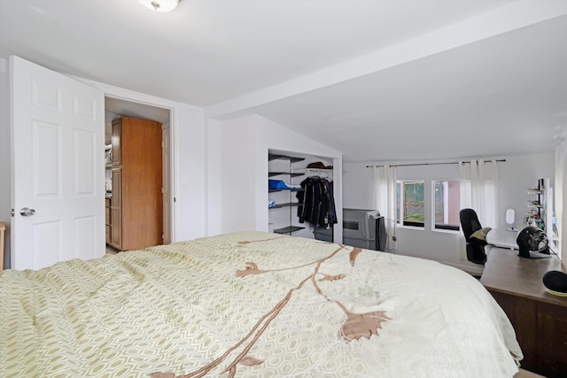 bedroom featuring vaulted ceiling and a closet