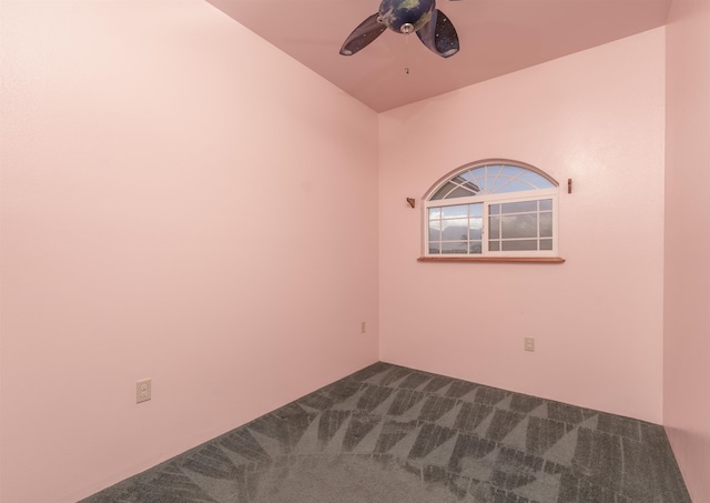 unfurnished room featuring ceiling fan and carpet floors