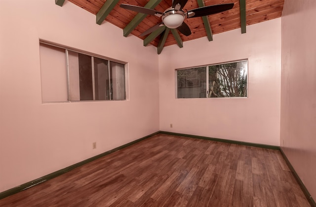 empty room with hardwood / wood-style flooring, vaulted ceiling with beams, ceiling fan, and wooden ceiling