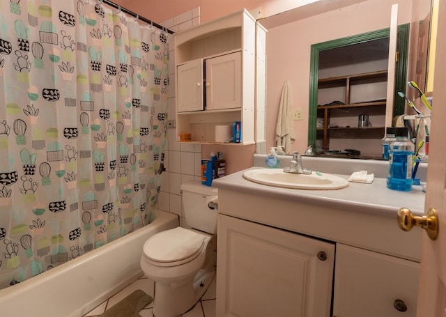 full bathroom with tile patterned floors, vanity, toilet, and shower / tub combo