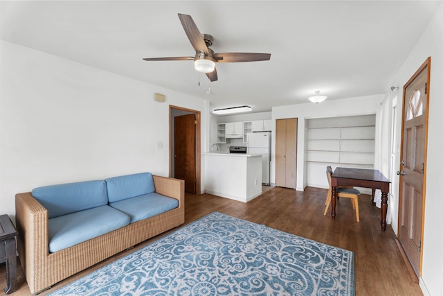 living room with dark hardwood / wood-style flooring and ceiling fan