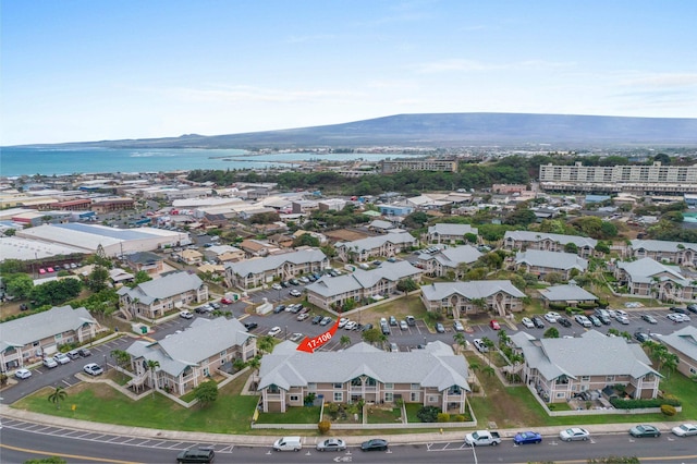 aerial view featuring a water and mountain view