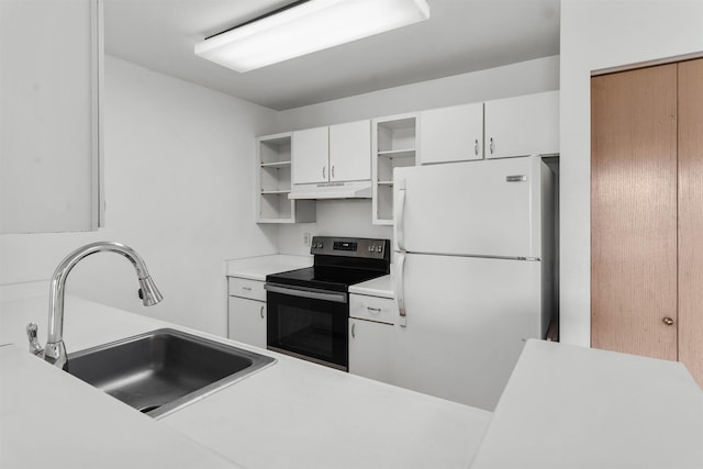 kitchen with sink, range with electric cooktop, white cabinets, and white fridge