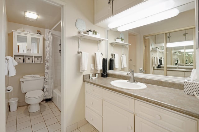 full bathroom featuring tile patterned floors, toilet, vanity, and shower / bath combo