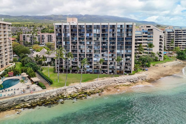 bird's eye view of apartment complex and mountains