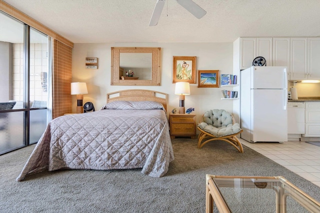 bedroom with freestanding refrigerator, light colored carpet, a textured ceiling, and ceiling fan