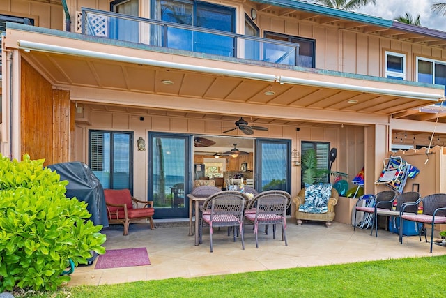 back of house featuring a patio, a balcony, and ceiling fan