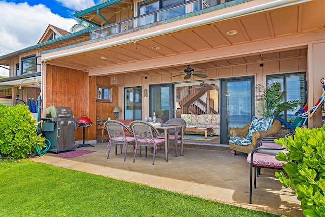 view of patio with outdoor dining area, grilling area, and a balcony