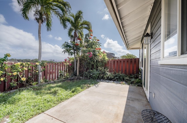 view of yard featuring a patio and fence