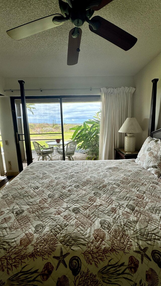 bedroom with a textured ceiling and ceiling fan