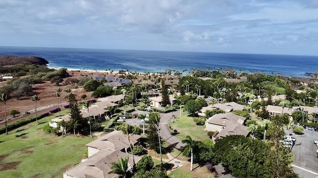 bird's eye view featuring a water view and a view of the beach