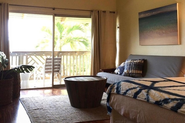 bedroom with access to exterior and wood-type flooring