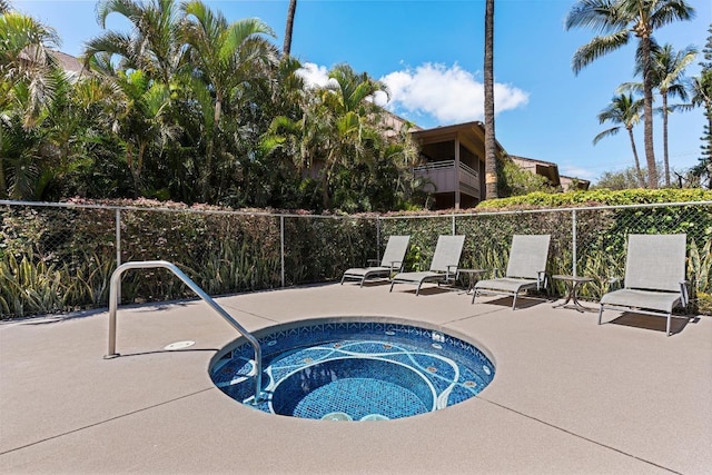 view of swimming pool featuring a patio area and a community hot tub