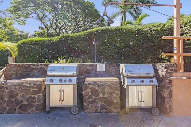 view of patio featuring a grill and an outdoor kitchen