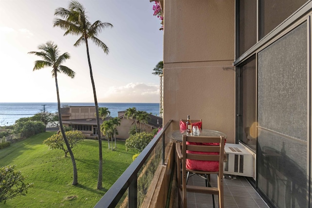 balcony with cooling unit and a water view