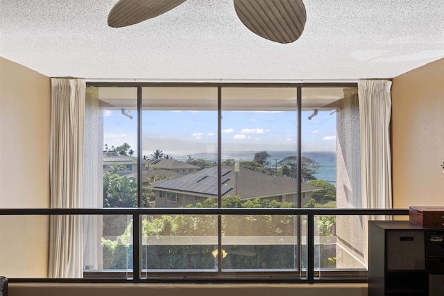 room details featuring a textured ceiling and ceiling fan