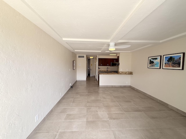 475 Front St Unit 308, Lahaina, HI 96761 - unfurnished living room featuring a ceiling fan, light tile patterned floors, and baseboards