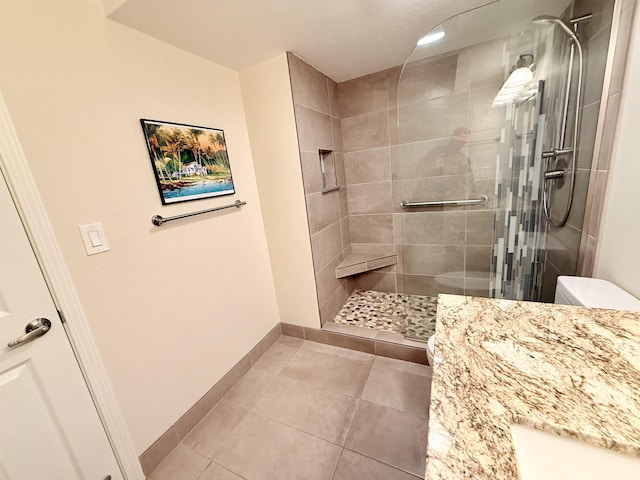 475 Front St Unit 308, Lahaina, HI 96761 - bathroom with toilet, a stall shower, baseboards, tile patterned flooring, and vanity