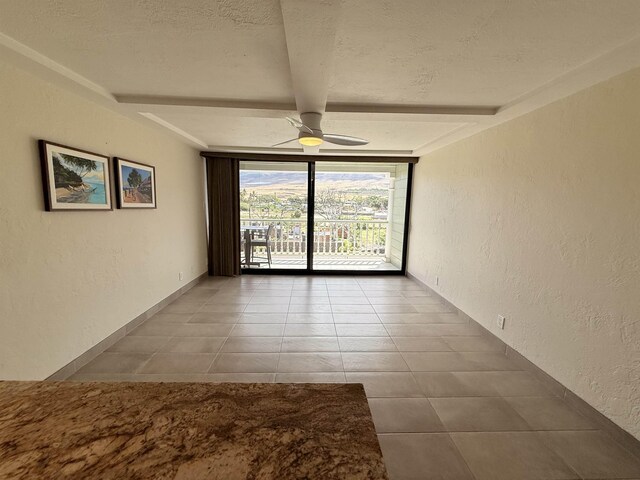 475 Front St Unit 308, Lahaina, HI 96761 - spare room featuring ceiling fan, a textured wall, tile patterned flooring, a textured ceiling, and beamed ceiling