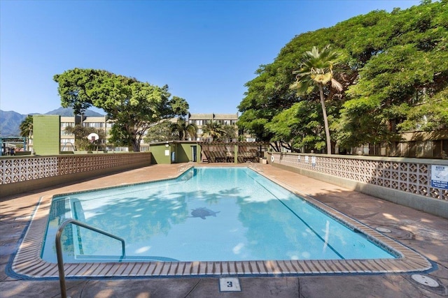 view of swimming pool featuring a mountain view