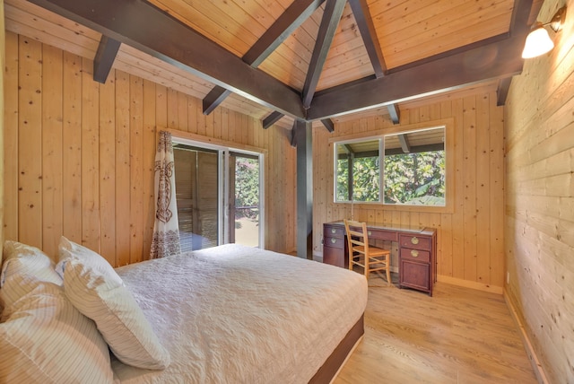 bedroom with access to outside, light wood-type flooring, beamed ceiling, and wood walls