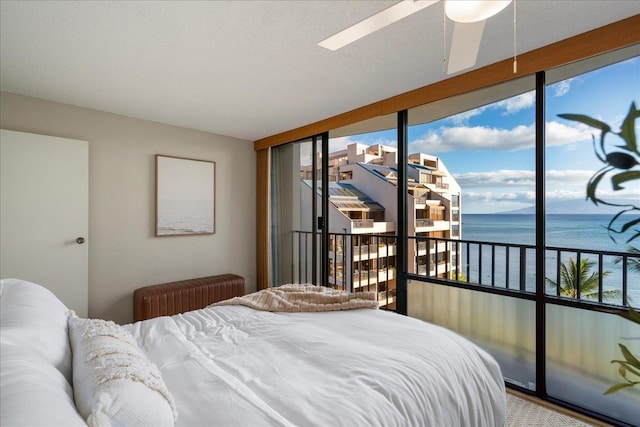 4327 Lower Honoapiilani Rd Unit 801, Lahaina, HI 96761 - bedroom featuring a water view, access to outside, and expansive windows